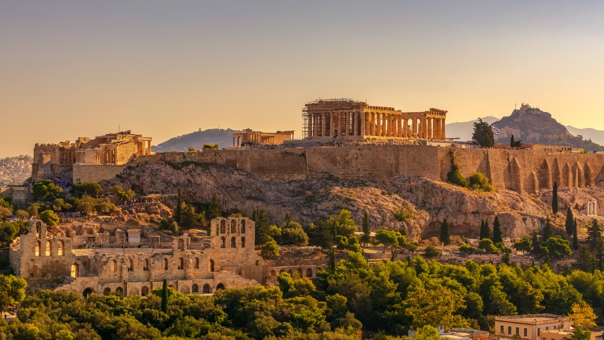 View of Acropolis of Athens with Parthenon and Erechtheion from Filopappou hill. Herodium, Lycabettus and Acropolis of Athens view from Filopappou hill a summer sunny day