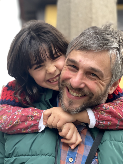 Portrait of Marco and his daughter smiling